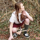 A British girl squats on the ground at an outdoor, wooded location and takes a powerful piss. Peeing only. Presented in 720P HD. Over 2 minutes.